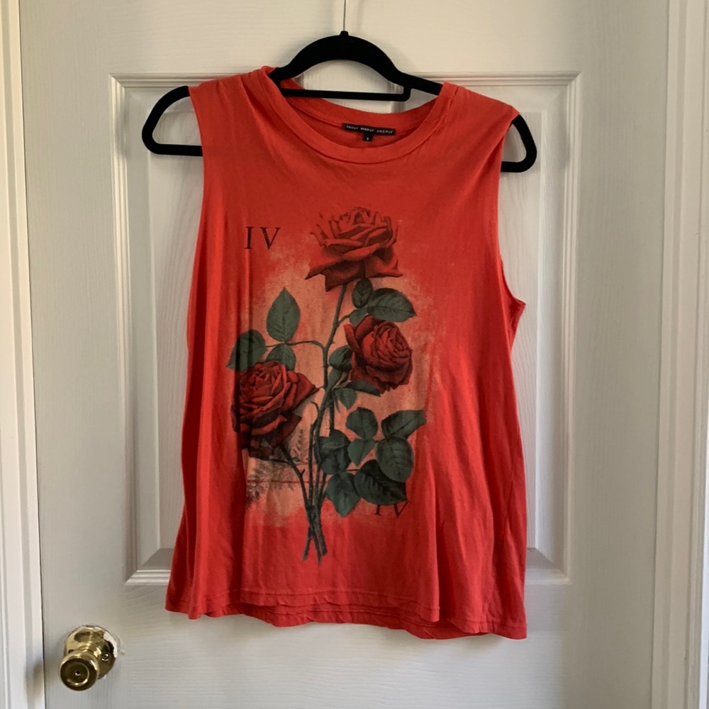 NWOT orange rose tank top. Never worn in perfect condition.